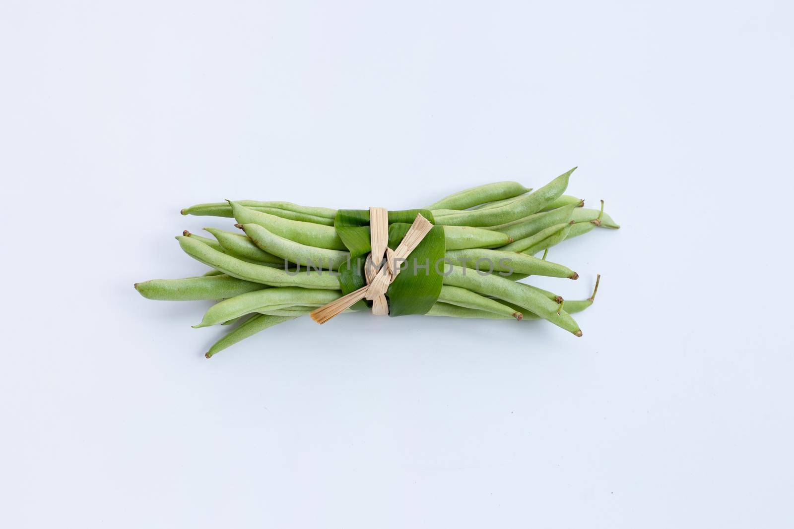 Green beans on white background.