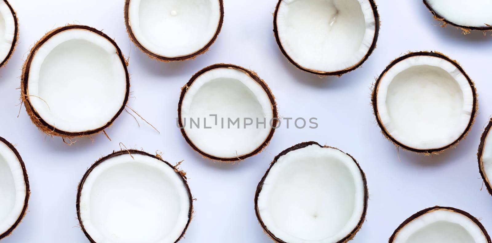 Coconuts on white background. Top view by Bowonpat