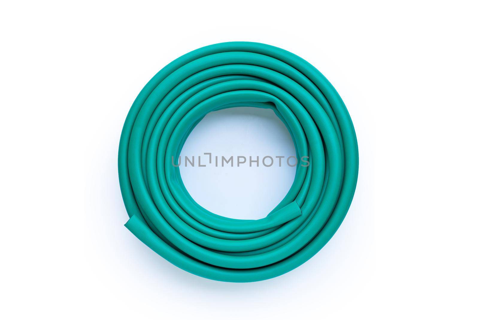 Green garden hose on white background.