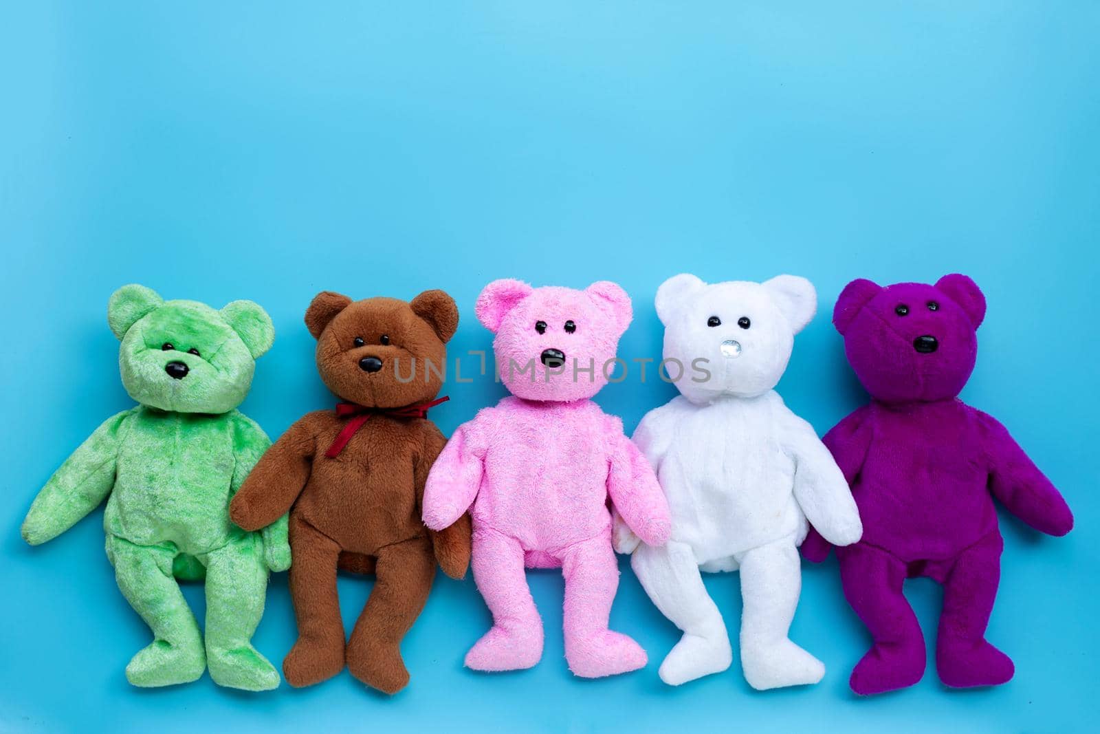 Toy bears on blue background.