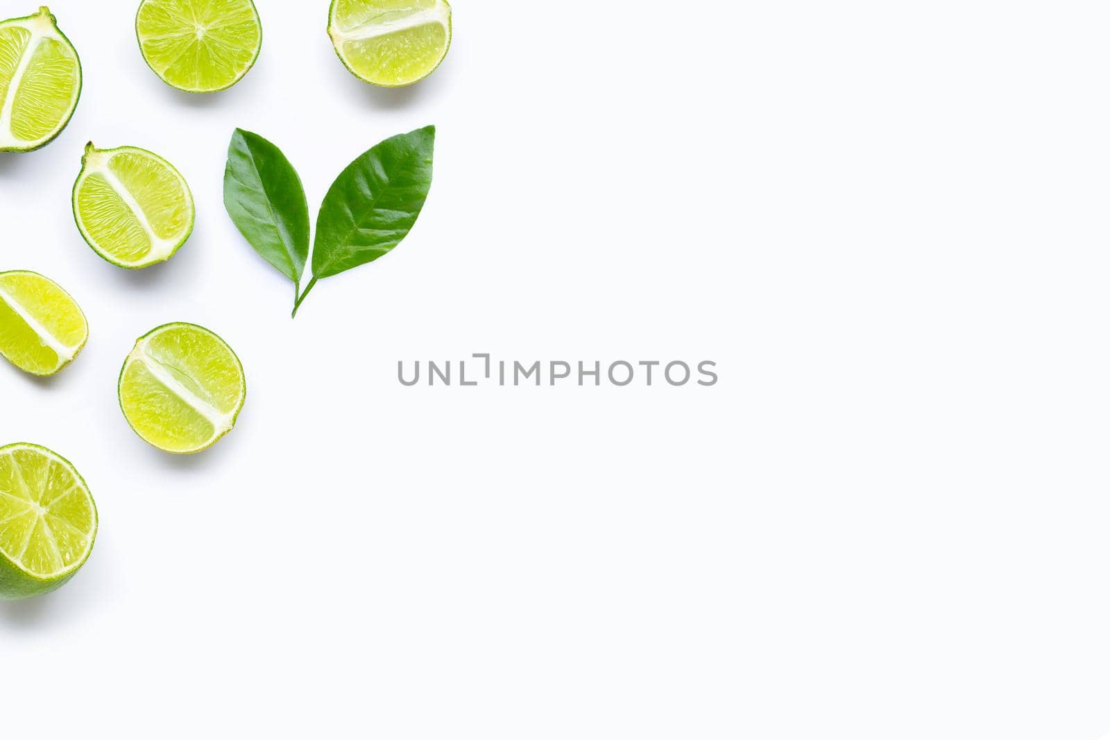 Limes with leaves isolated on white background.