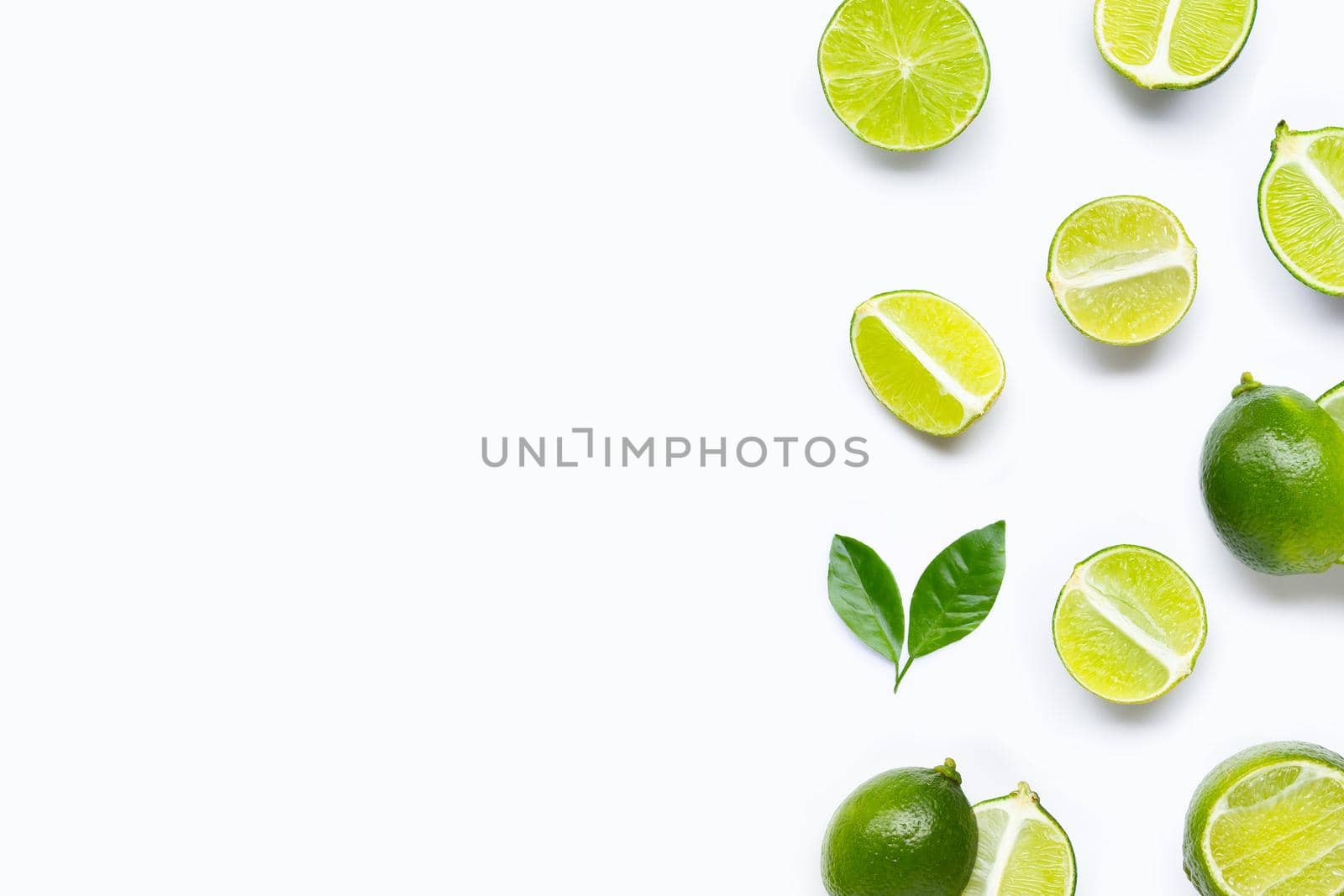 Limes with leaves isolated on white background.