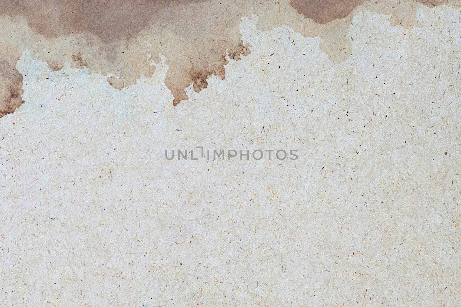 Old brown paper grunge background. Abstract liquid coffee color texture.