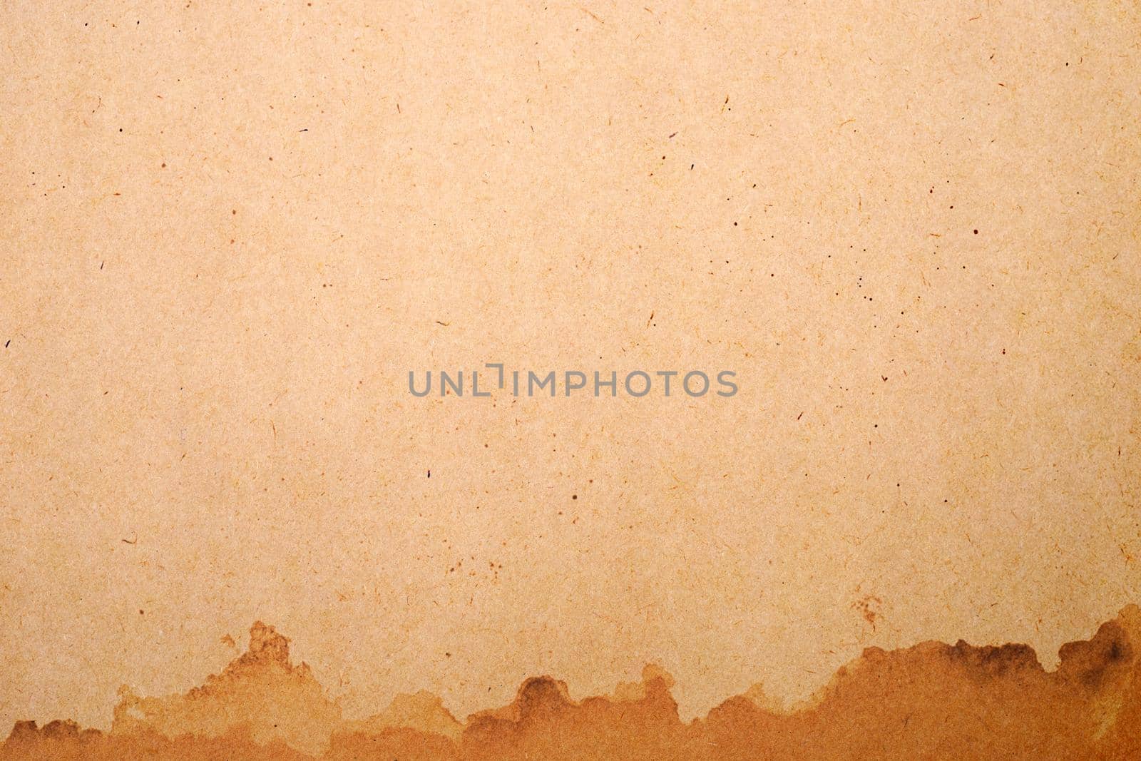 Old brown paper grunge background. Abstract liquid coffee color texture.