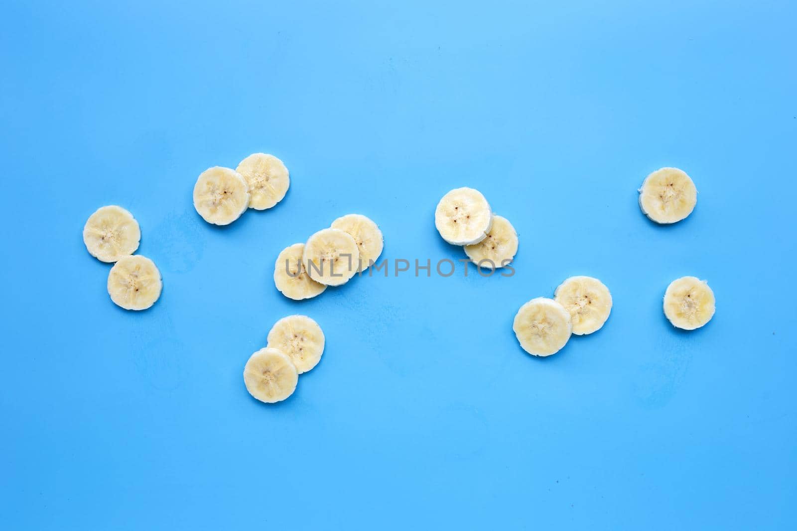 Banana slices on blue background.
