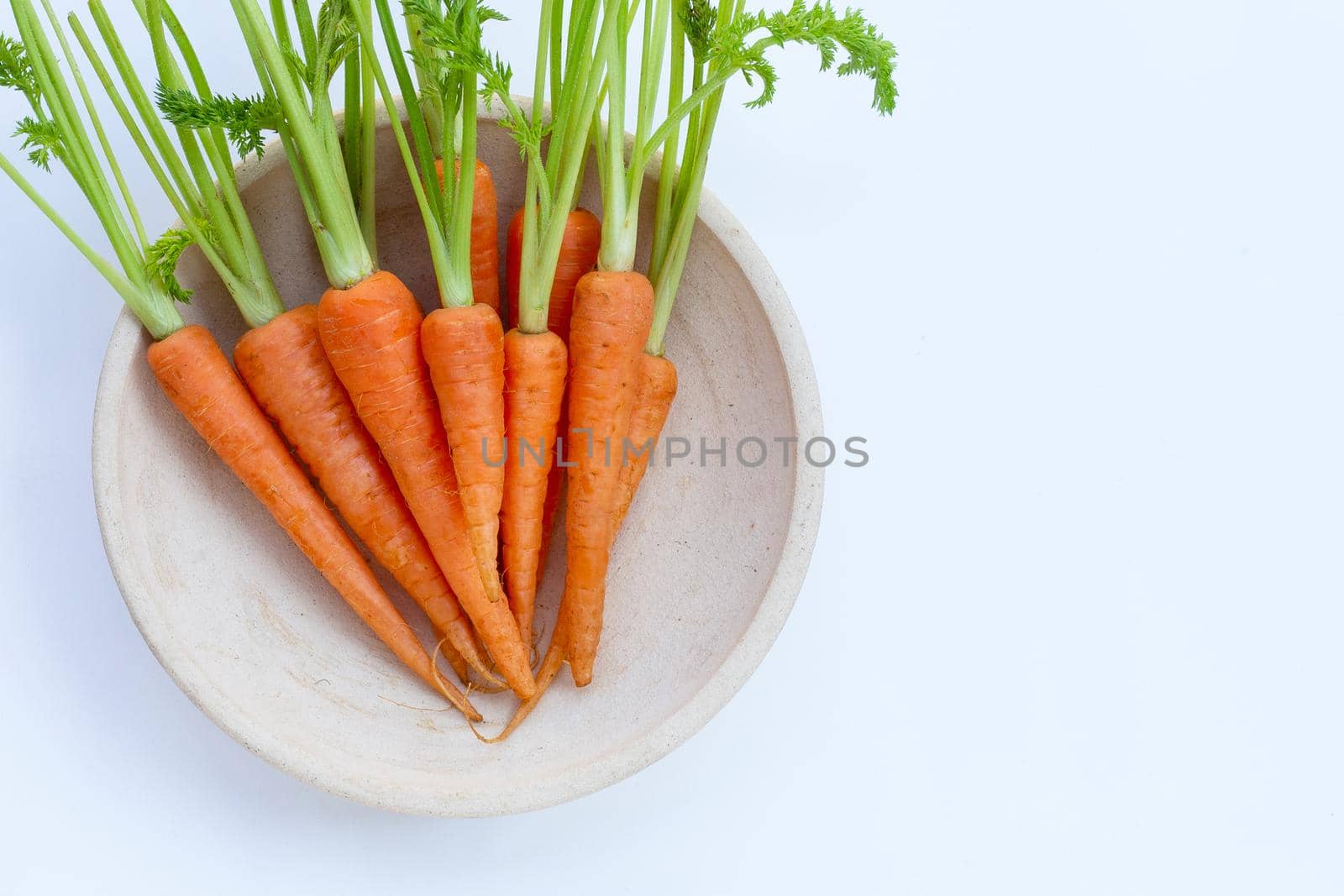 Fresh carrots on white background.