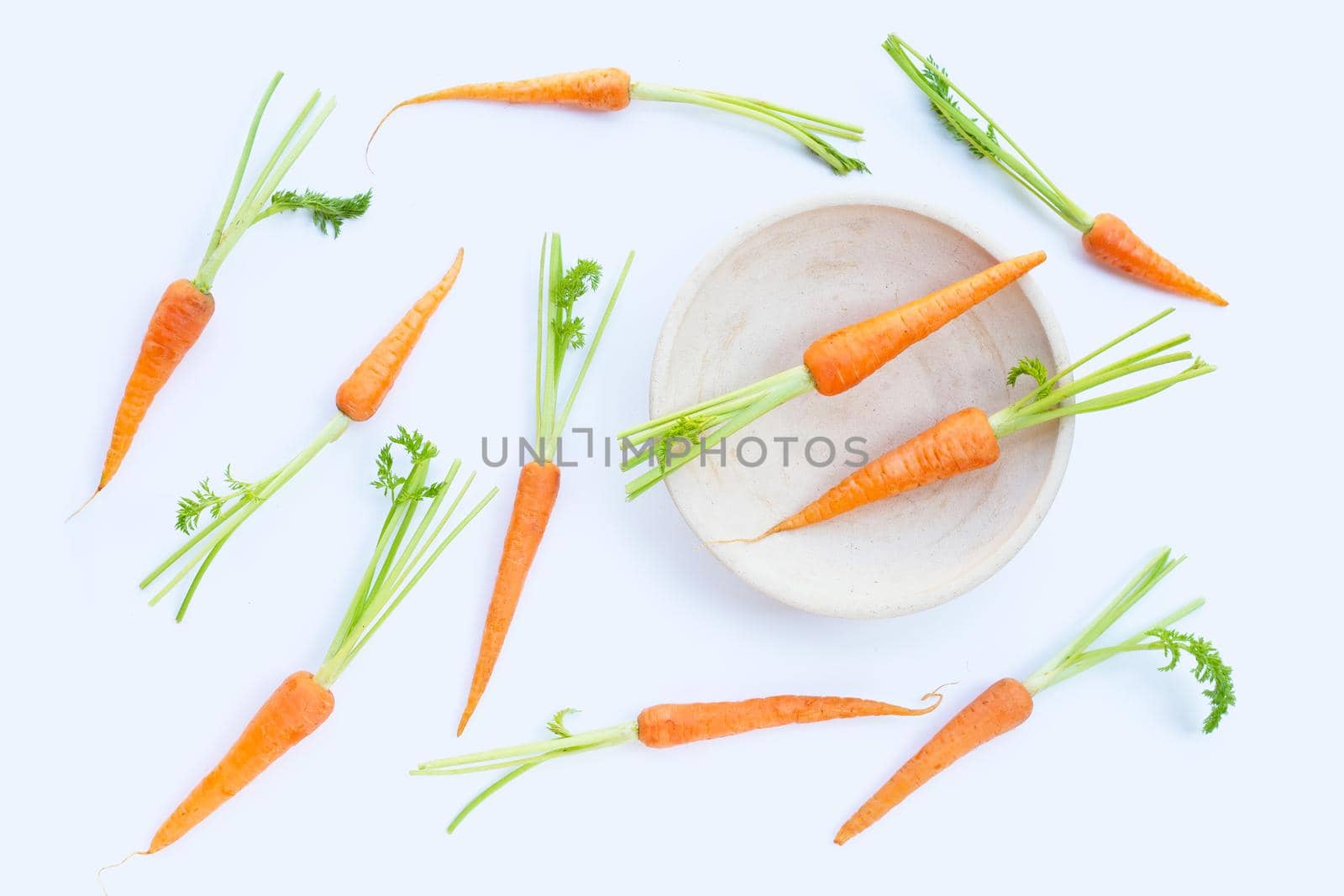 Fresh carrots on white background.