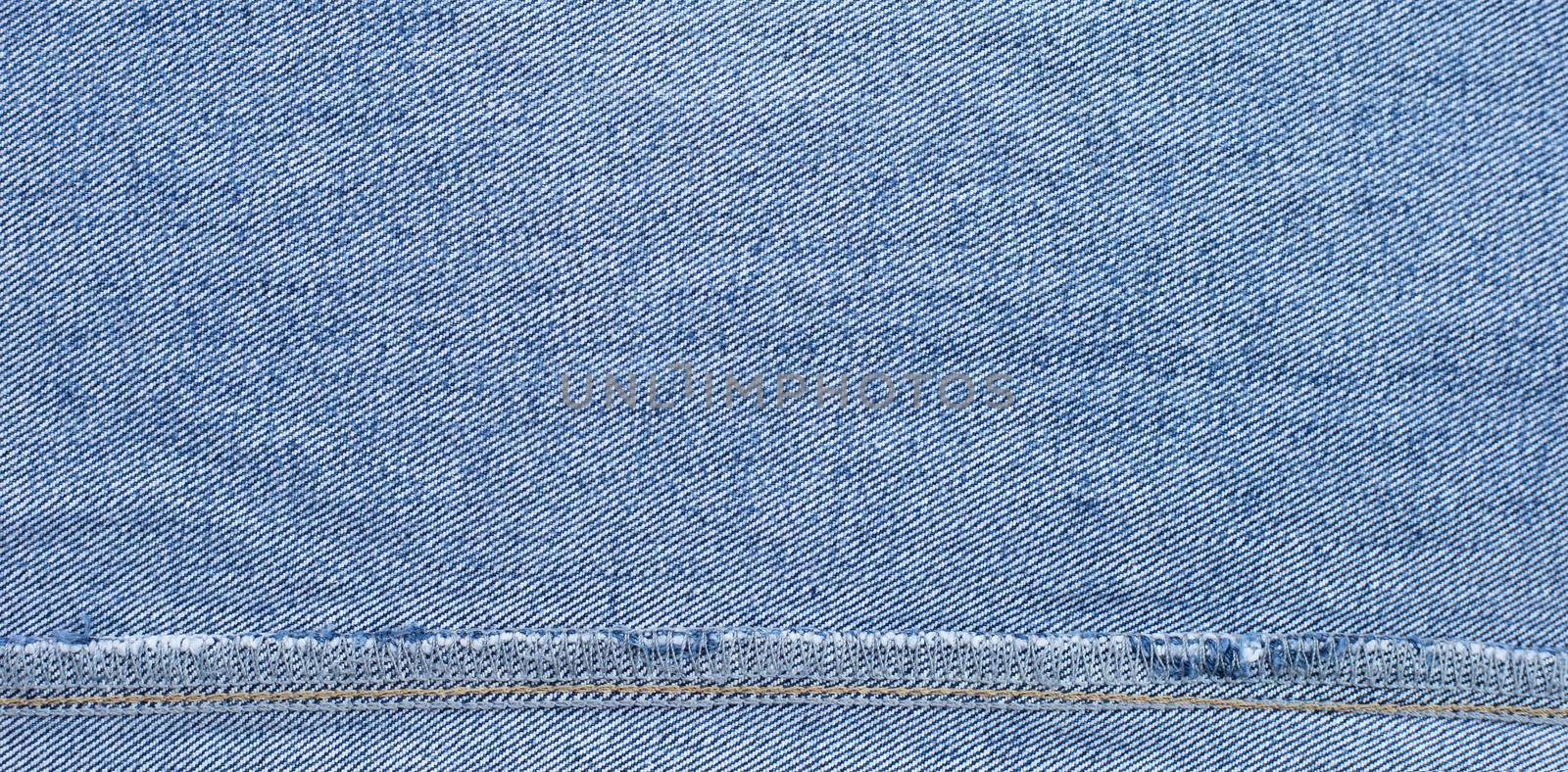 Close up of inside blue jeans texture background.