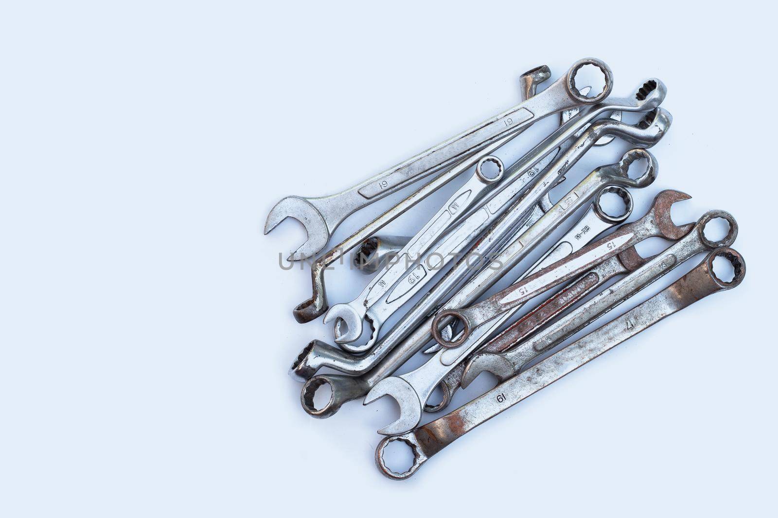 Old wrench on white background.