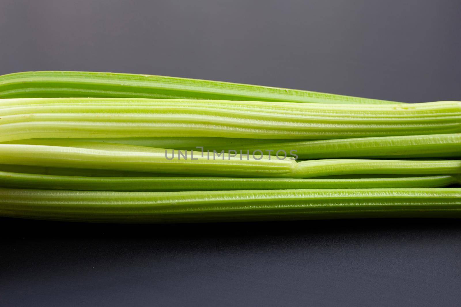 Fresh celery on dark background. 