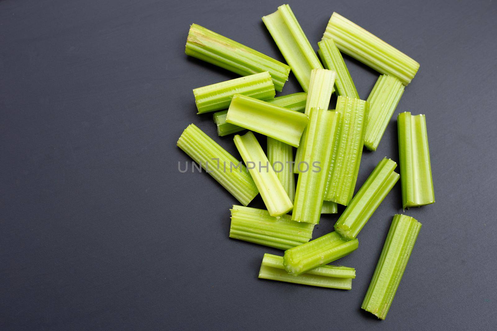 Fresh celery on dark background.