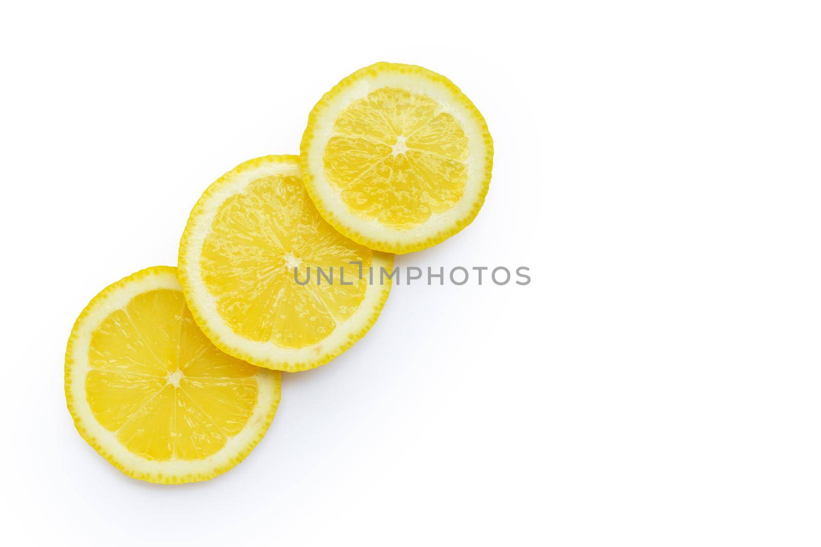Fresh lemon slices isolated on white background.