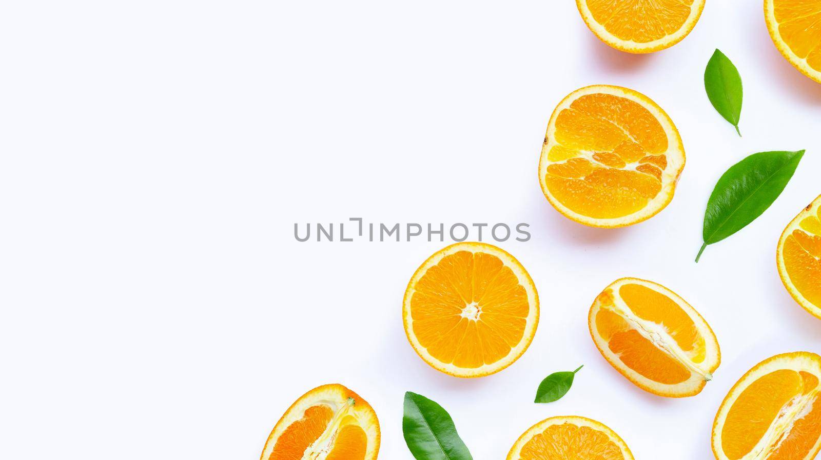 Oranges with leaves on white background. Copy space