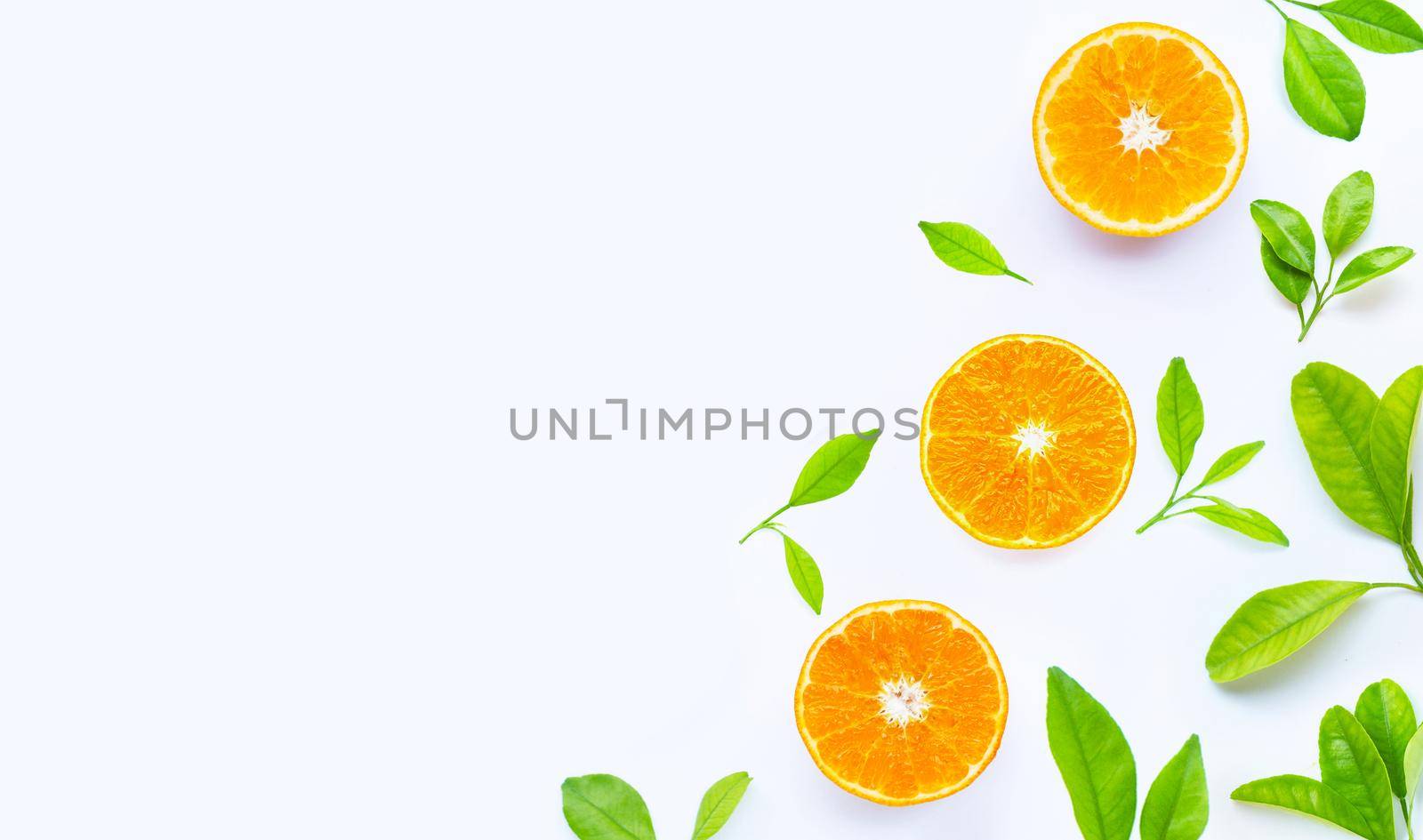 High vitamin C, Juicy and sweet. Fresh orange fruit with green leaves on white.