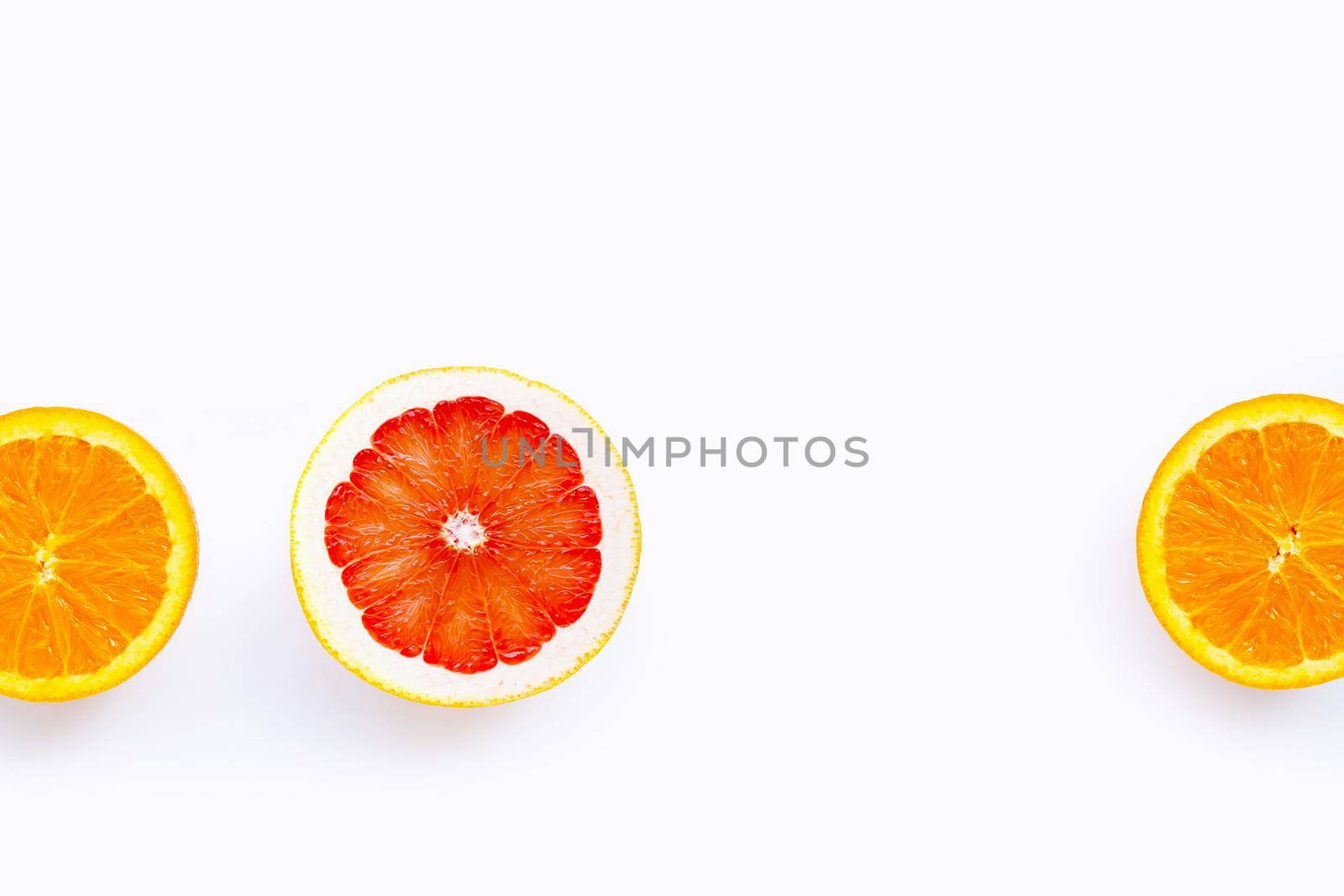 High vitamin C, Juicy and sweet. Fresh orange and grapefruit on white background. Copy space
