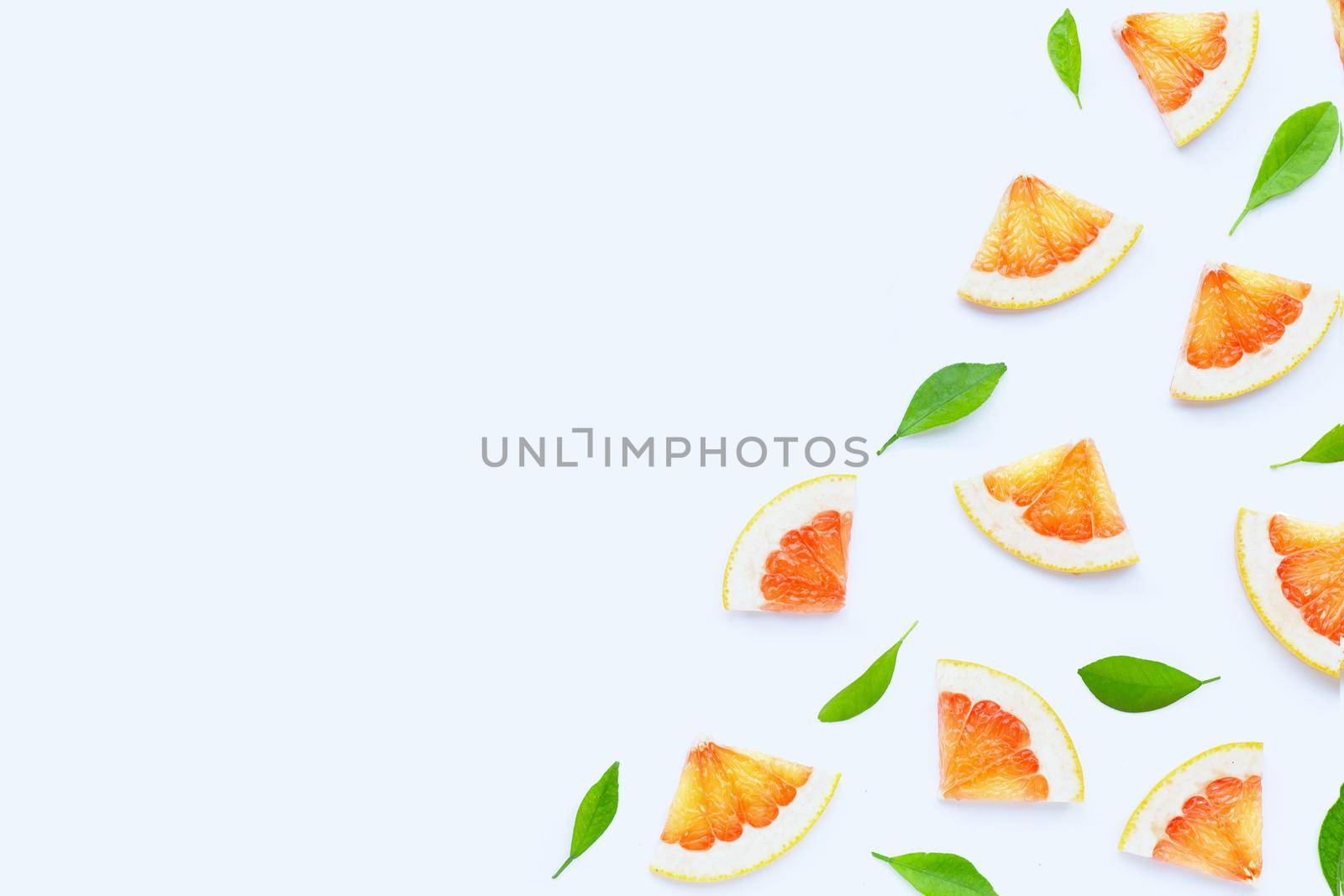 High vitamin C. Juicy grapefruit slices on white background.