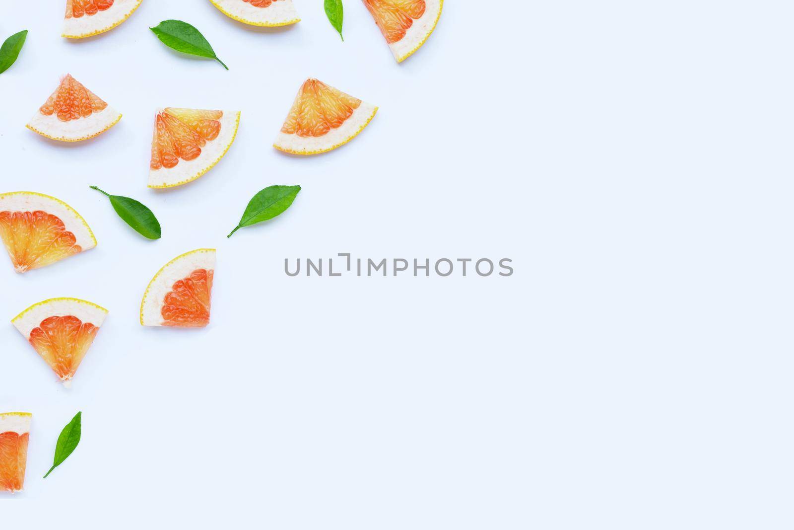 High vitamin C. Juicy grapefruit slices on white background.