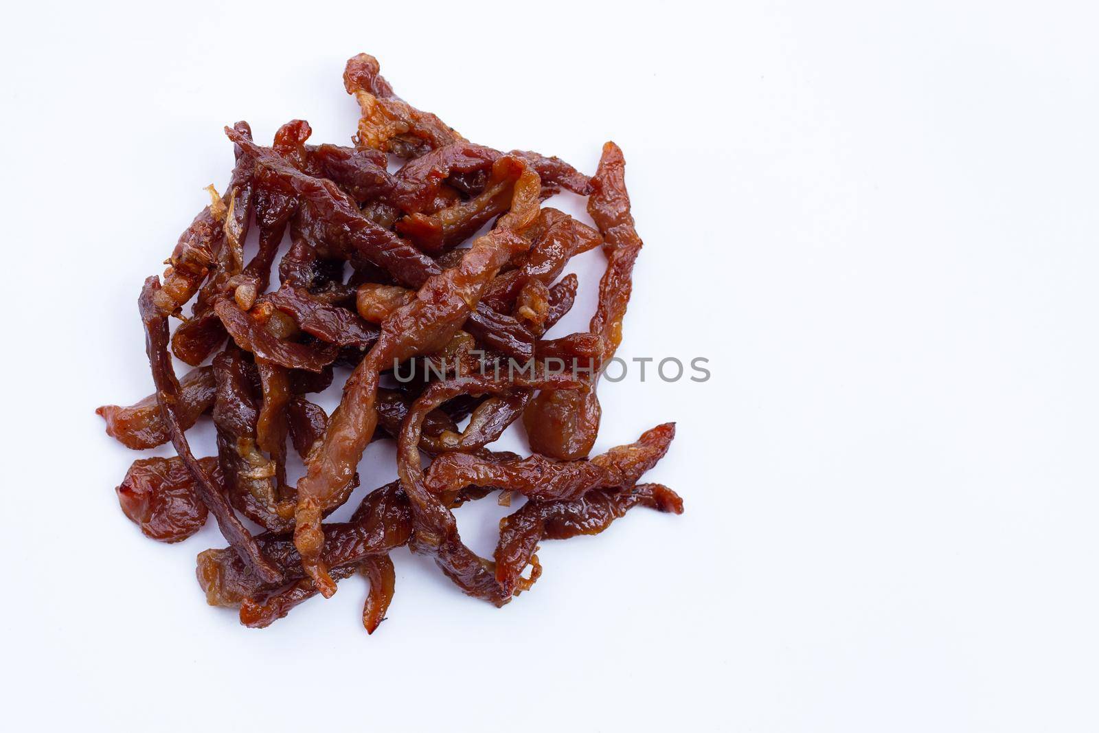 Deep fried sun-dried pork on white background.