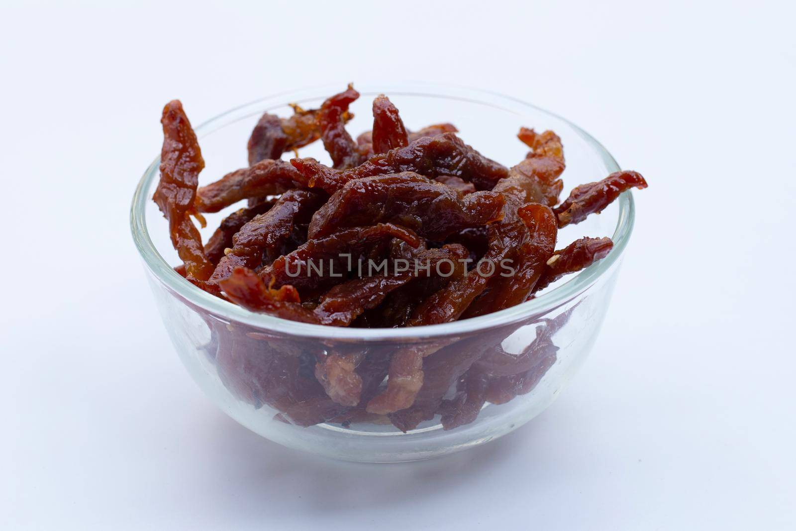 Deep fried sun-dried pork on white background.