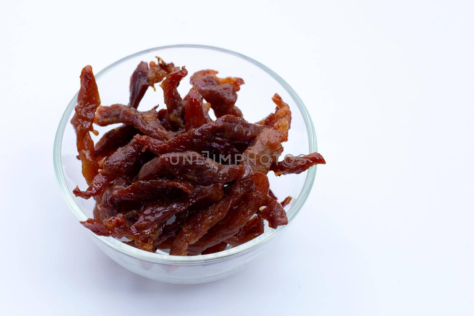 Deep fried sun-dried pork on white background.