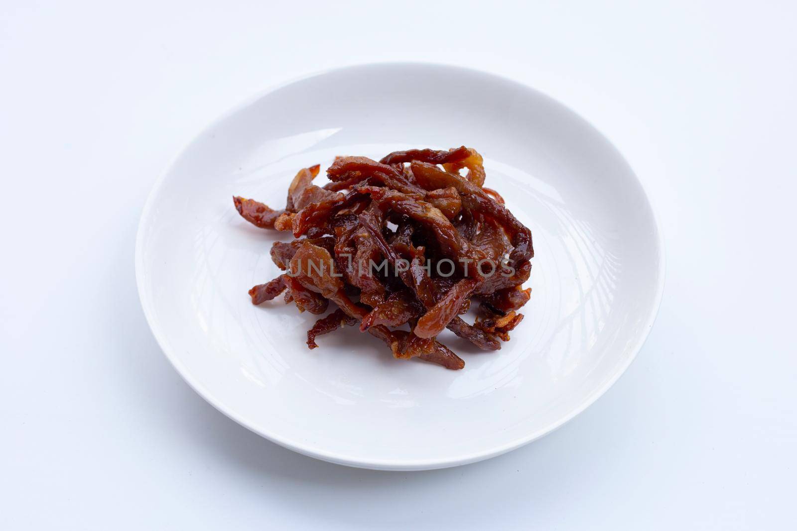 Deep fried sun-dried pork on white background.