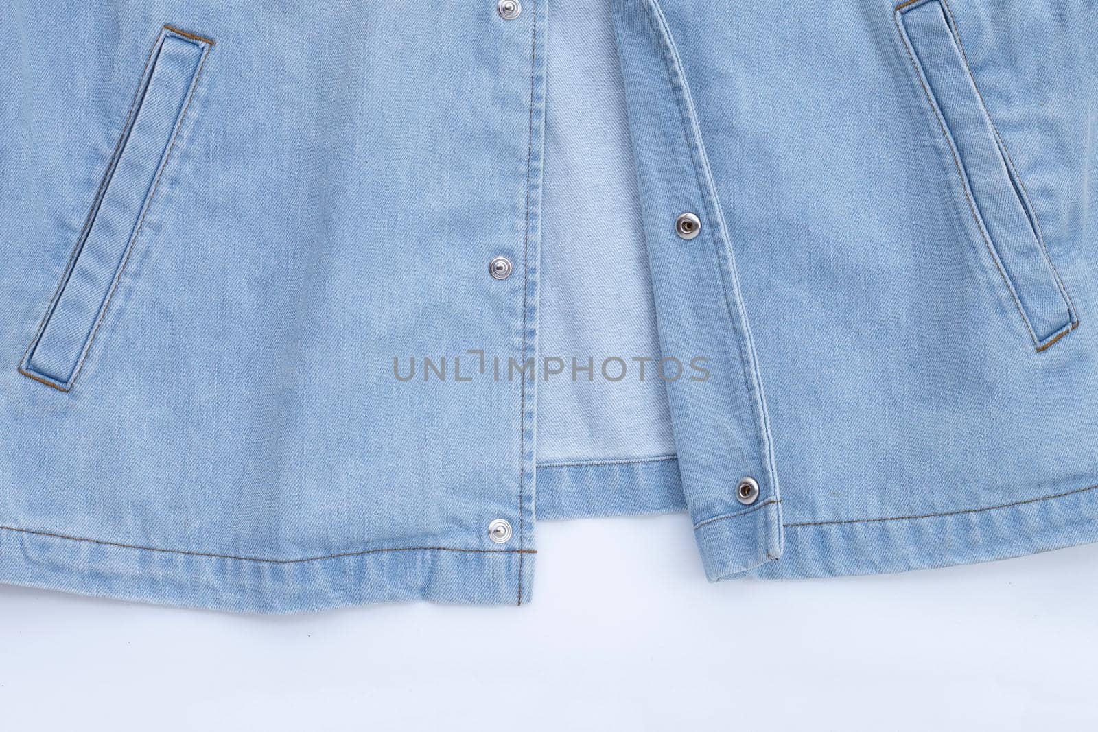 Close up jeans shirt texture on white. Copy space