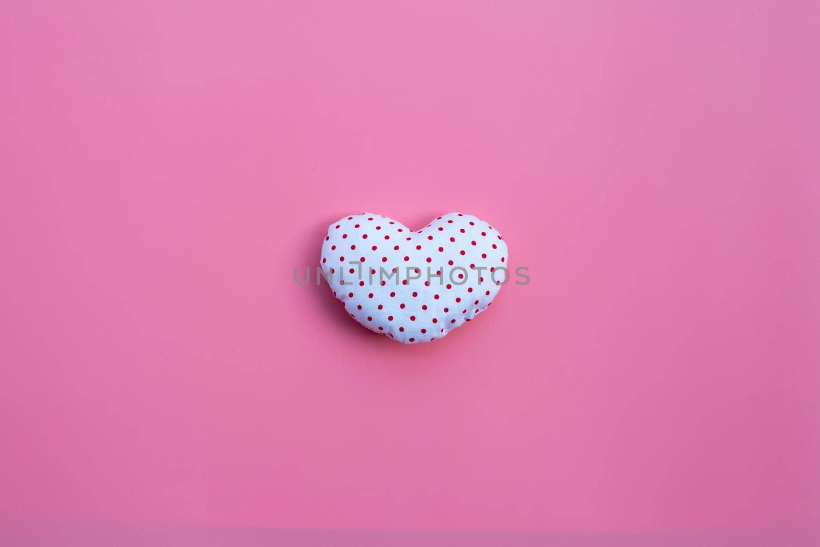 Valentine's heart on pink background. Copy space