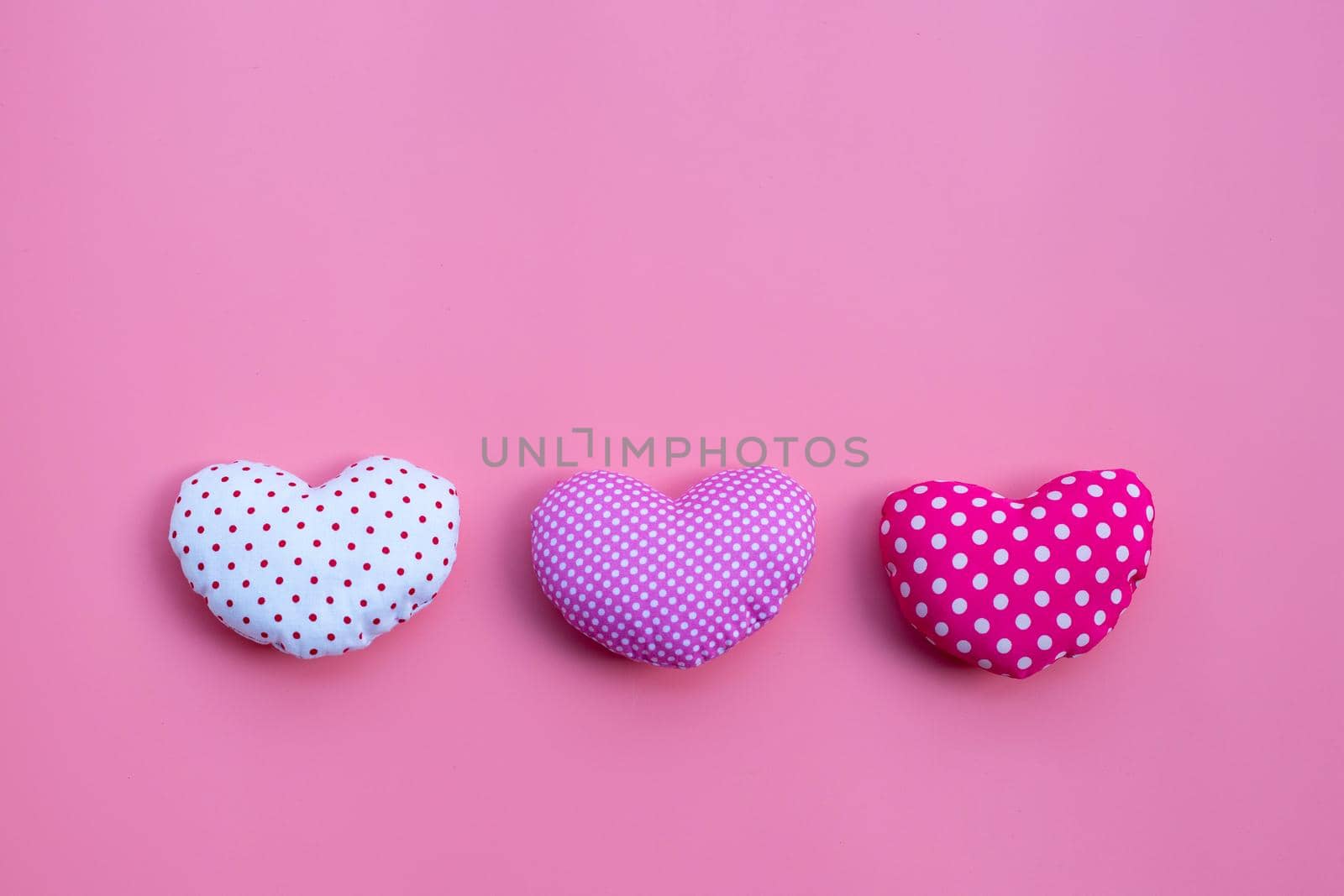 Valentine's hearts on pink background. Copy space