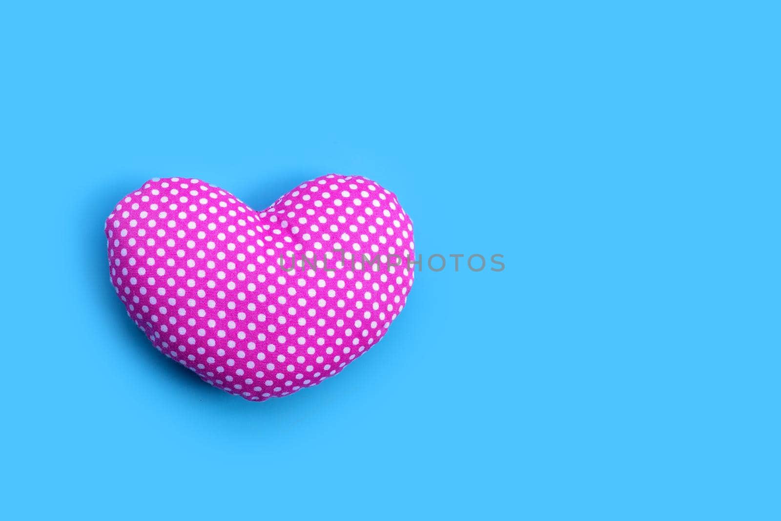 Valentine's heart on blue background. Copy space