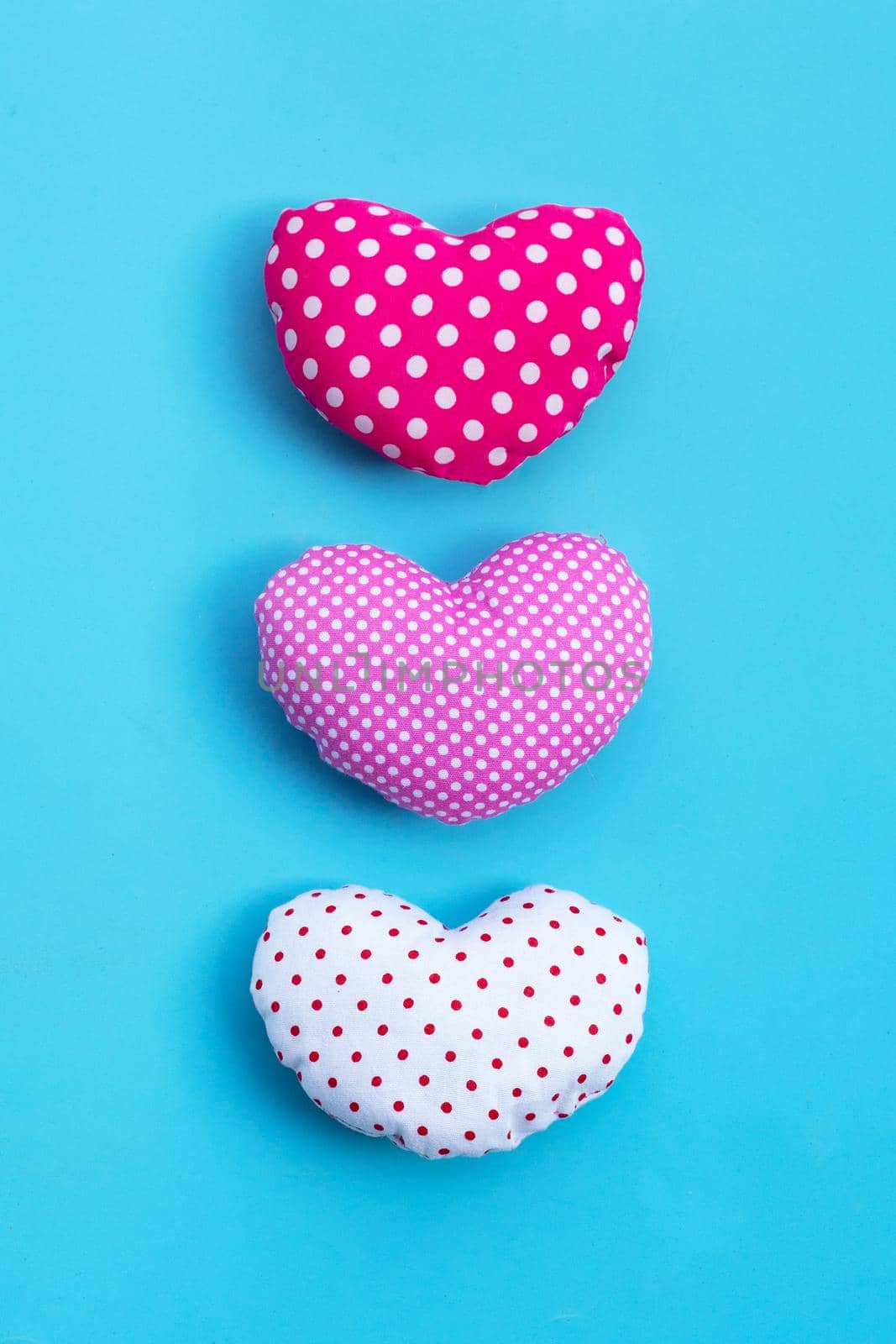 Valentine's hearts on blue background. Copy space