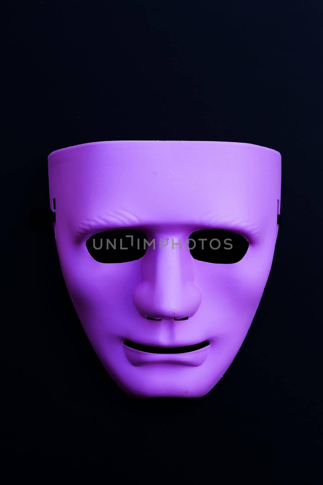Face mask on dark background. Top view