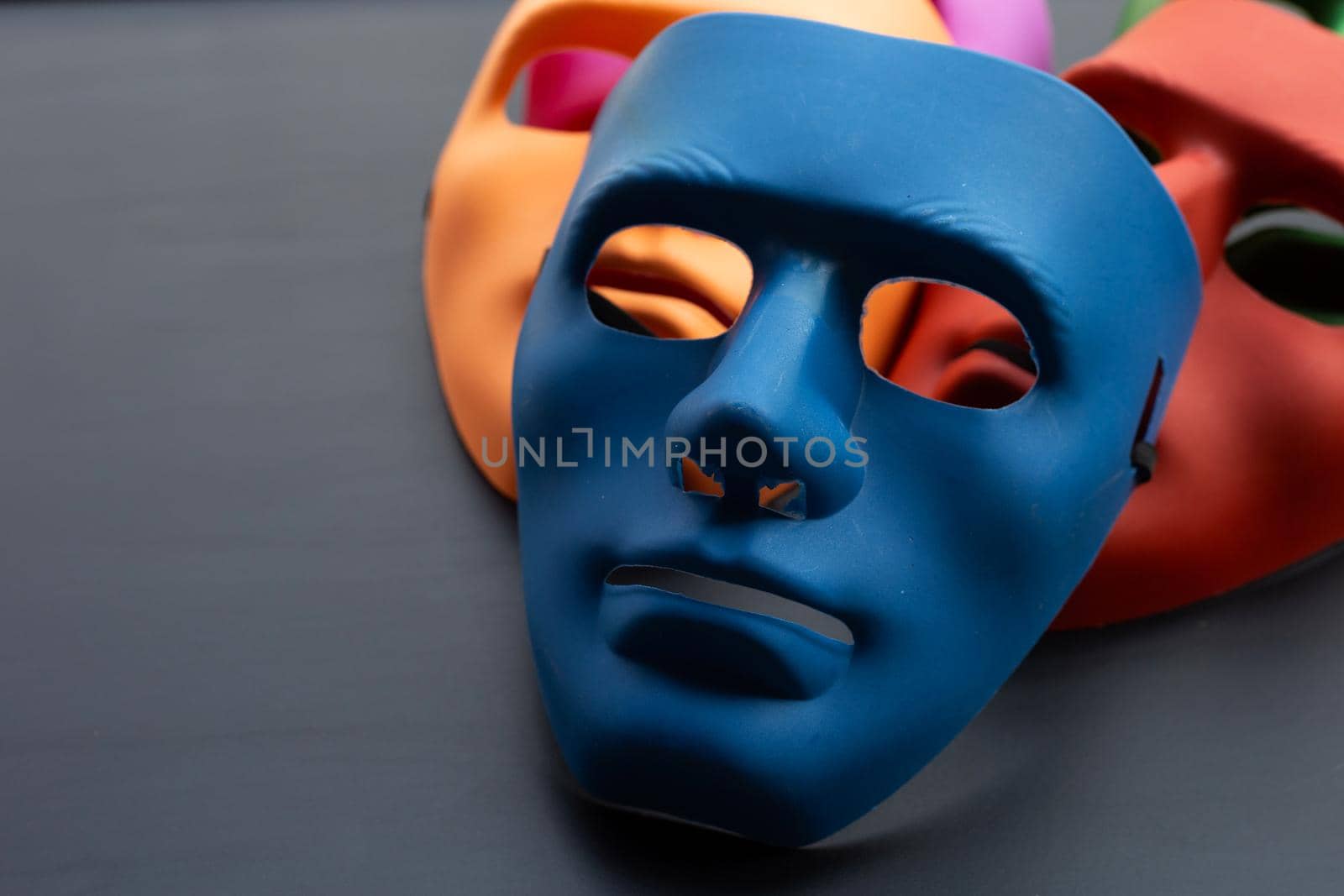 Face masks on dark background. Copy space