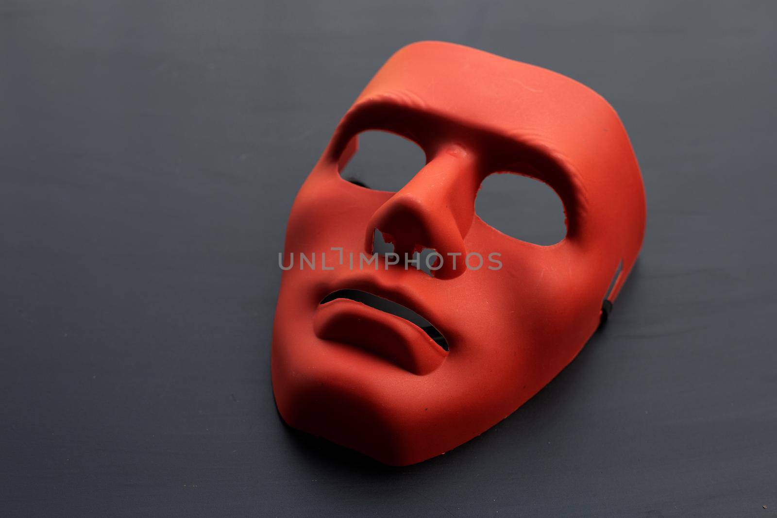 Face mask on dark background.
