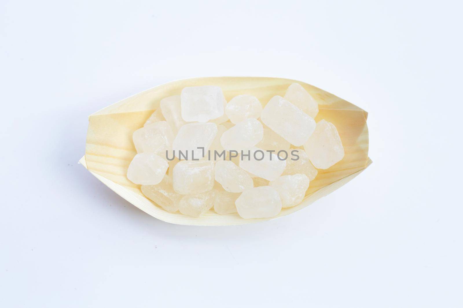 Crystal rock sugar on white background.