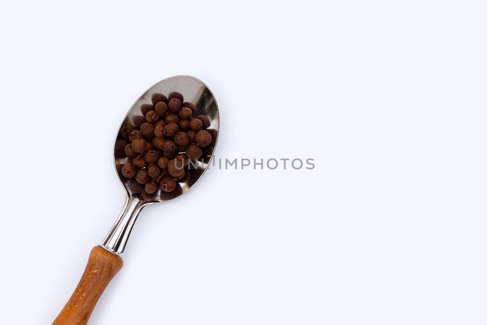 Allspice on white background. Copy space