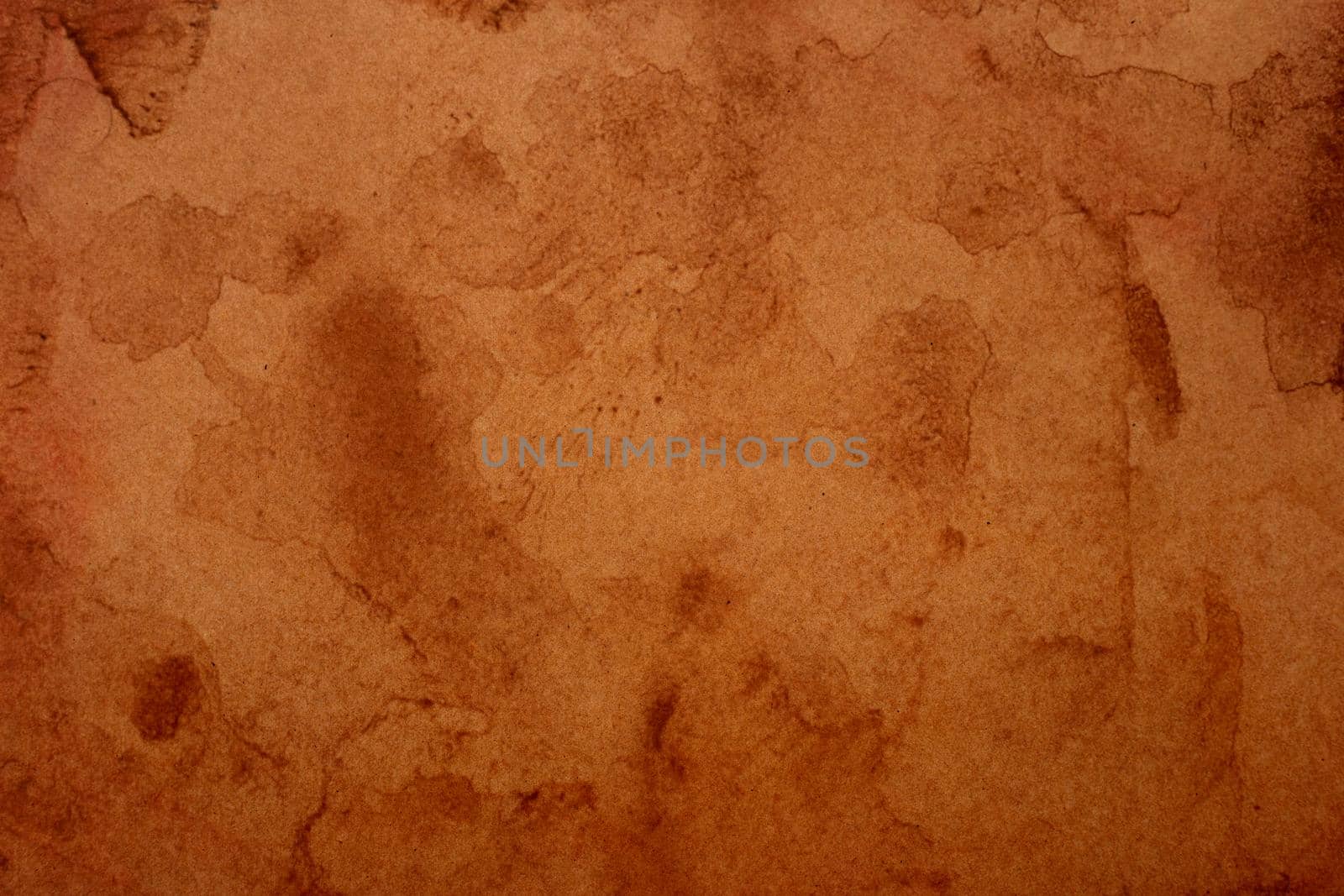 Old brown paper grunge background. Abstract liquid coffee color texture.