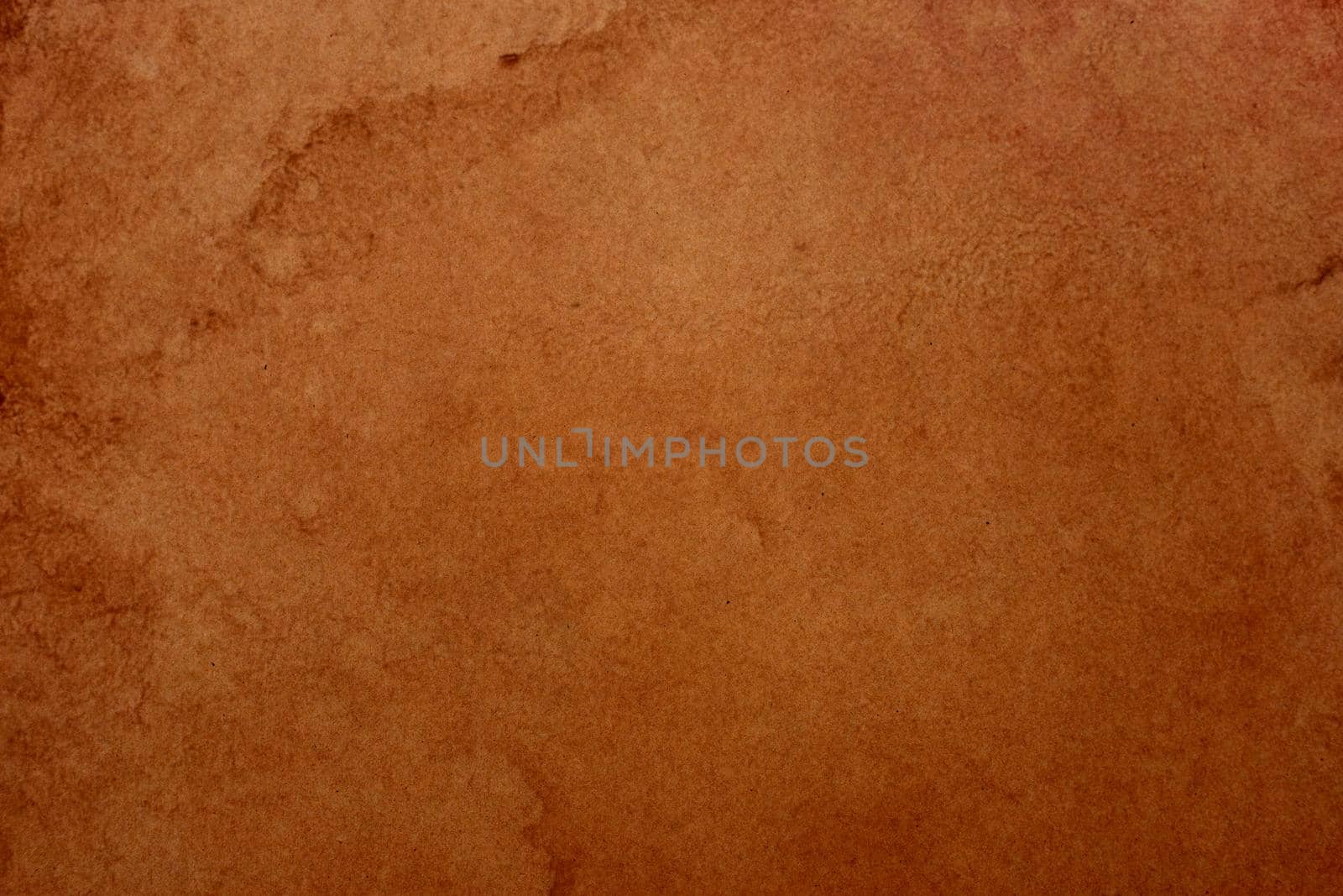 Old brown paper grunge background. Abstract liquid coffee color texture.