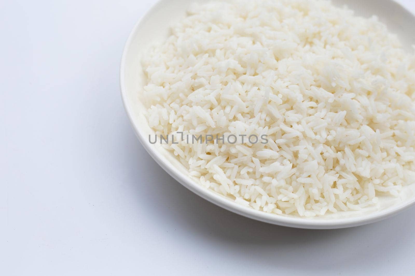 Dish of rice on white background.