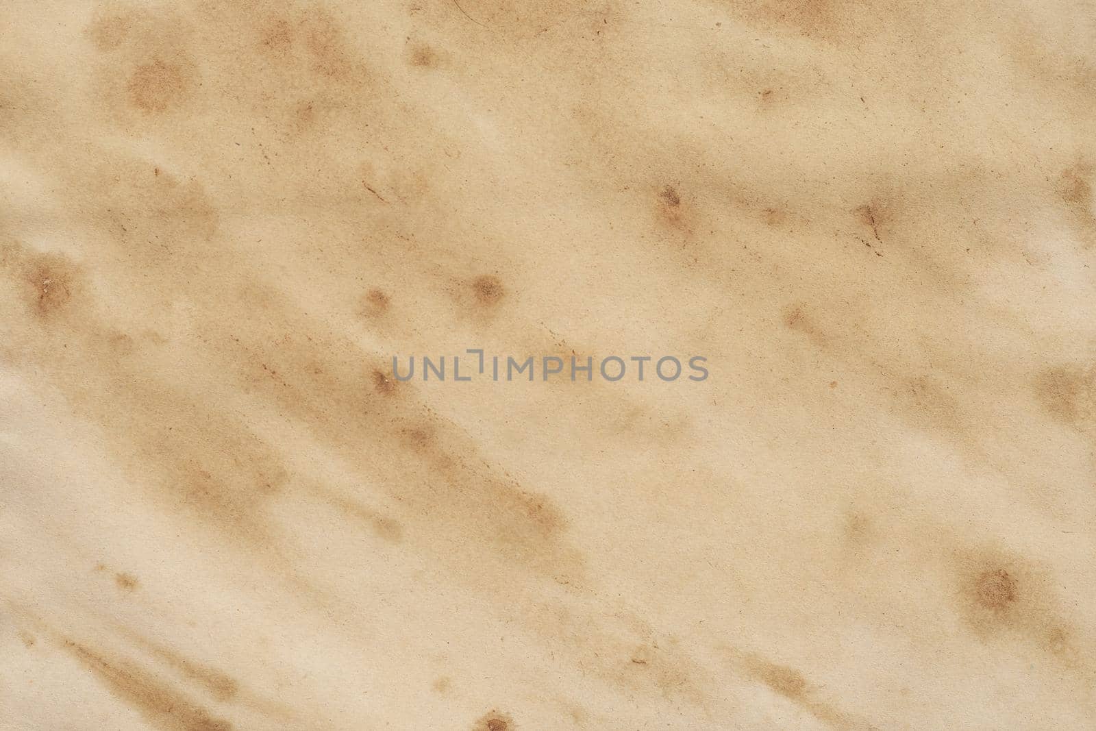 Old brown paper grunge background. Abstract liquid coffee color texture.