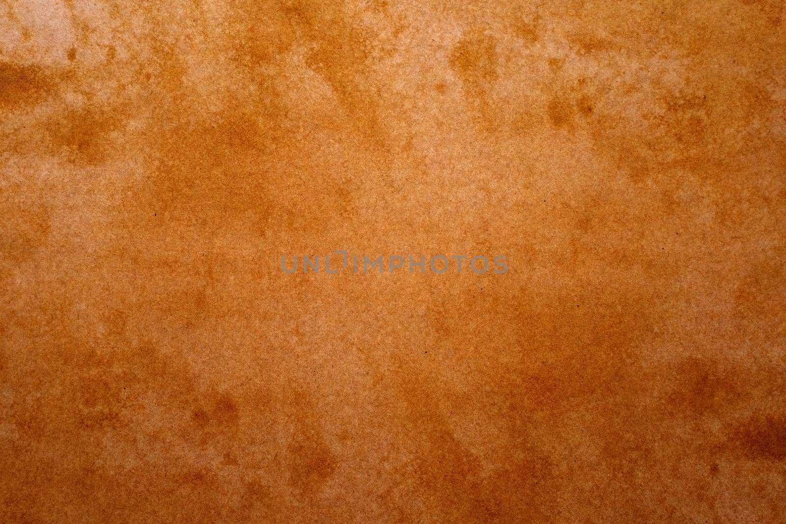 Old brown paper grunge background. Abstract liquid coffee color texture.