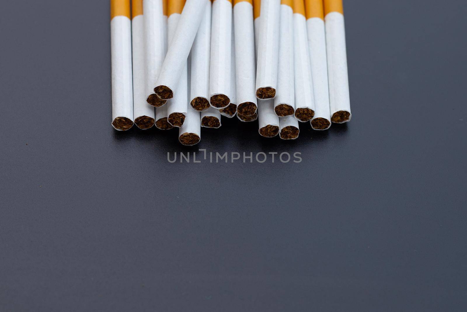 Cigarette on dark background. Non smoking for health concept