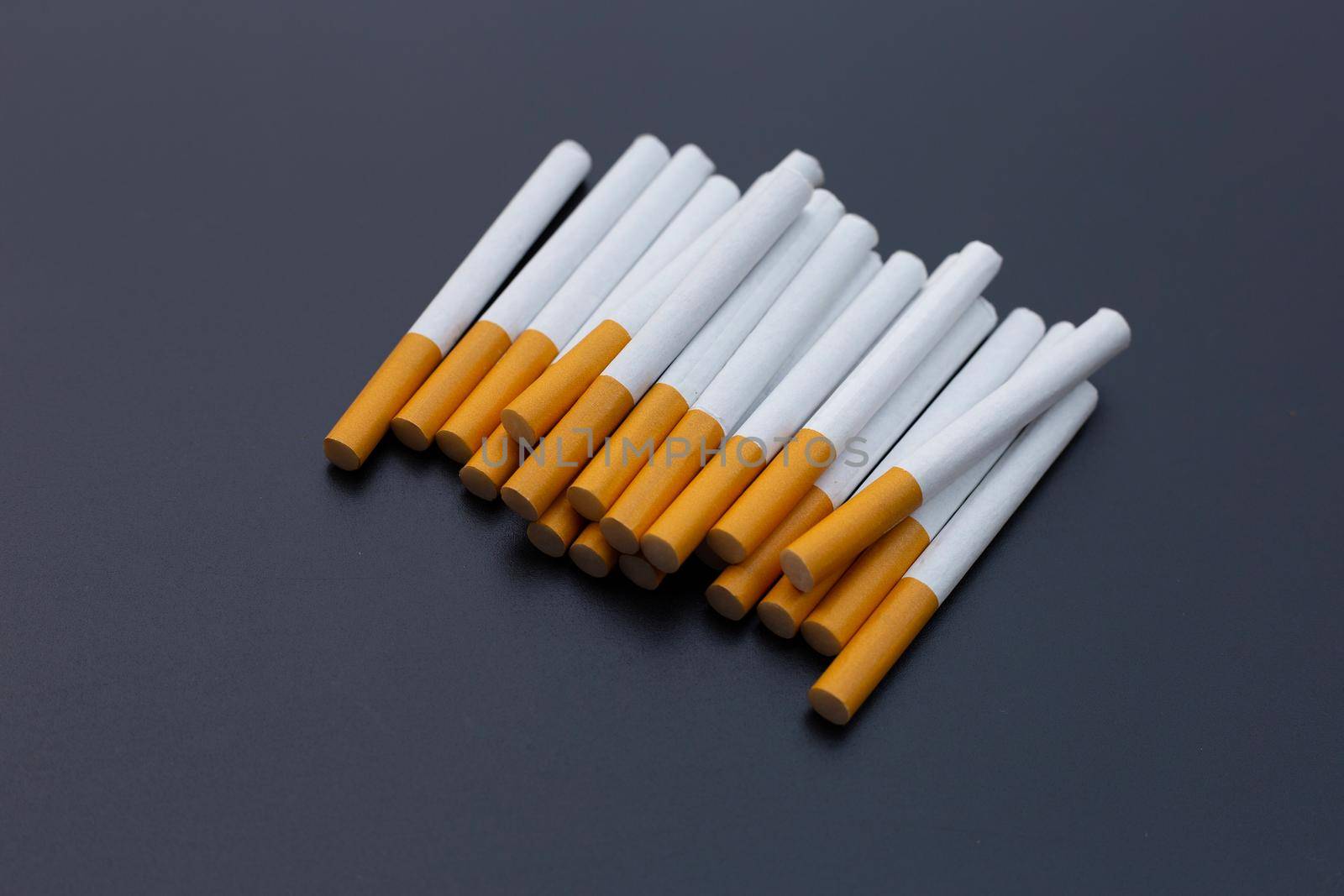 Cigarette on dark background. Non smoking for health concept