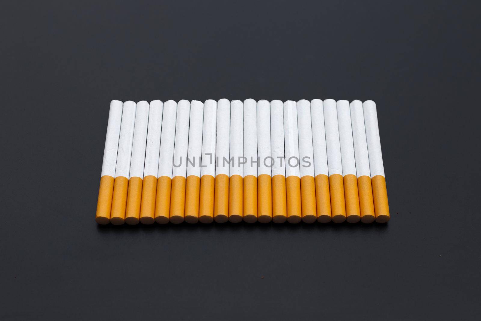 Cigarette on dark background. Non smoking for health concept