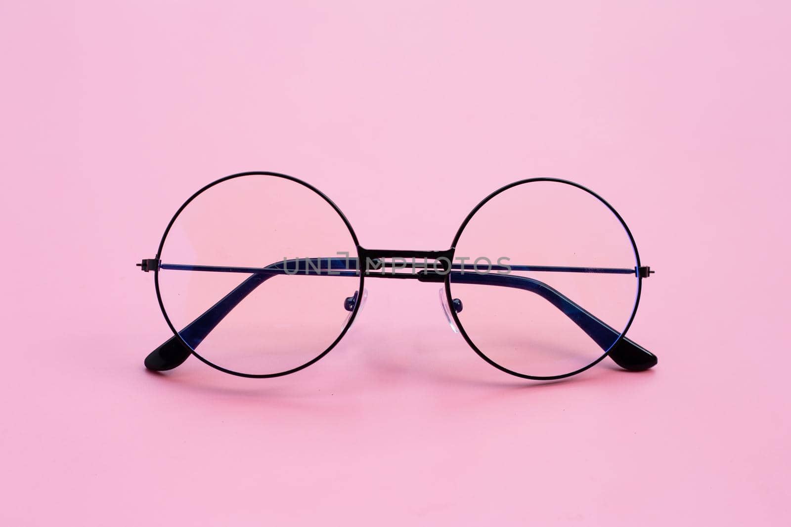 Eye Glasses on pink background. Copy space