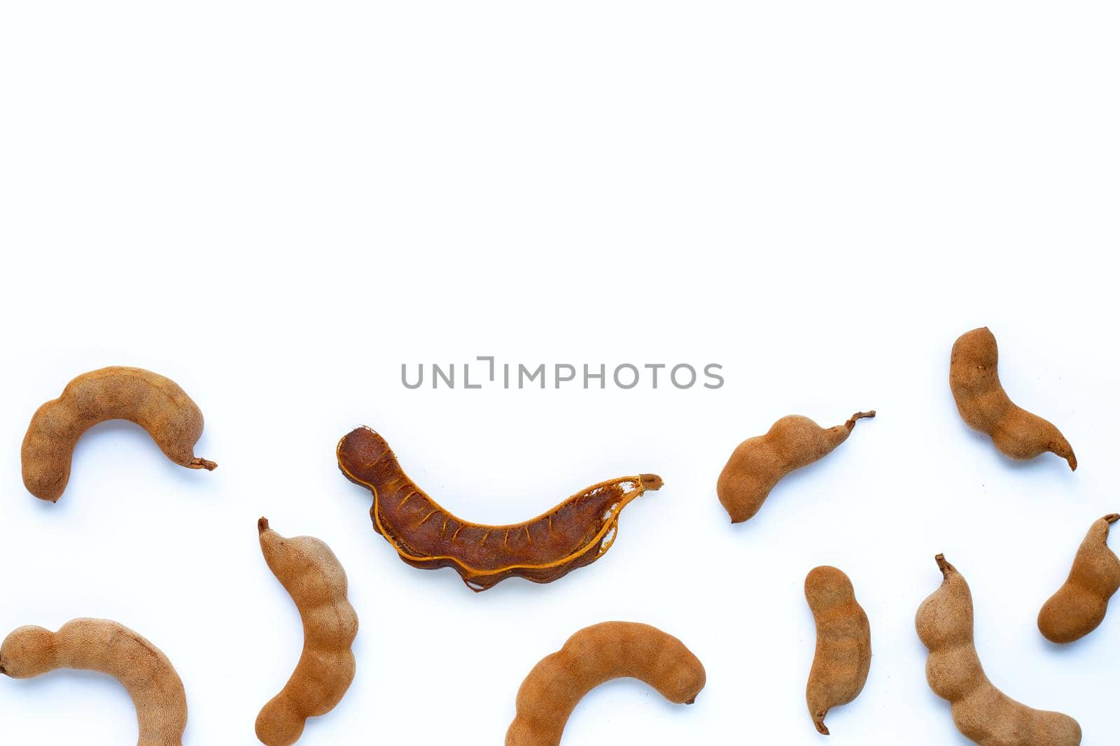 Tamarind tropical fruit on white background. Top view