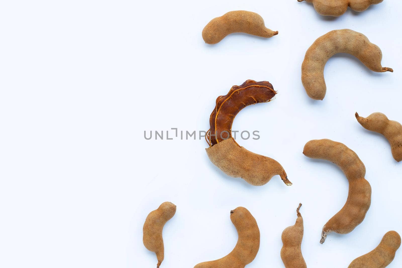Tamarind tropical fruit on white background. Top view