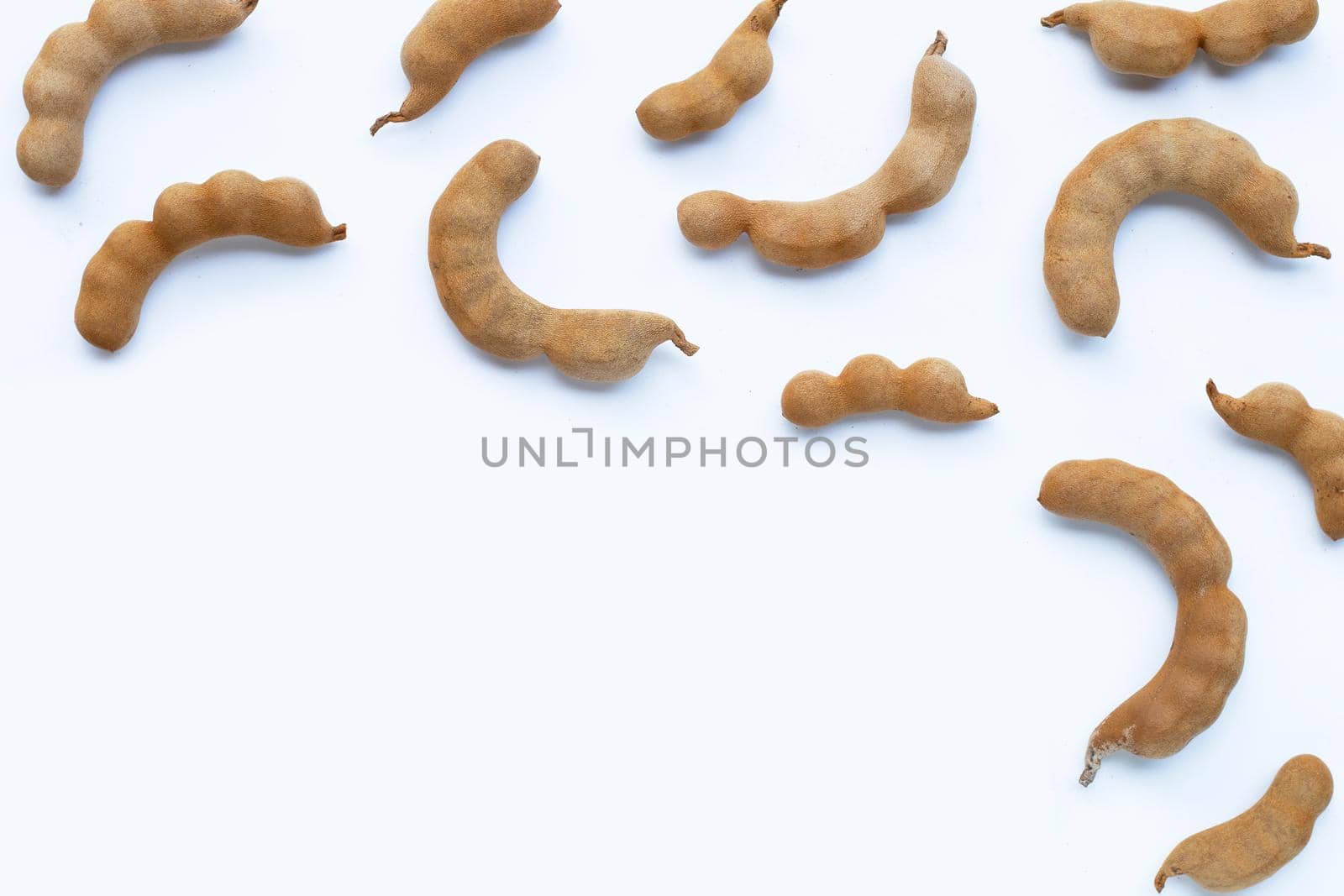 Tamarind tropical fruit on white background. Top view