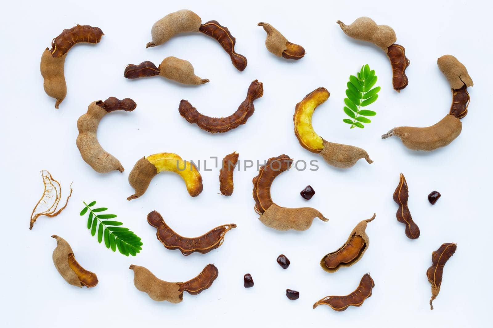 Tamarind tropical fruit on white background. Top view