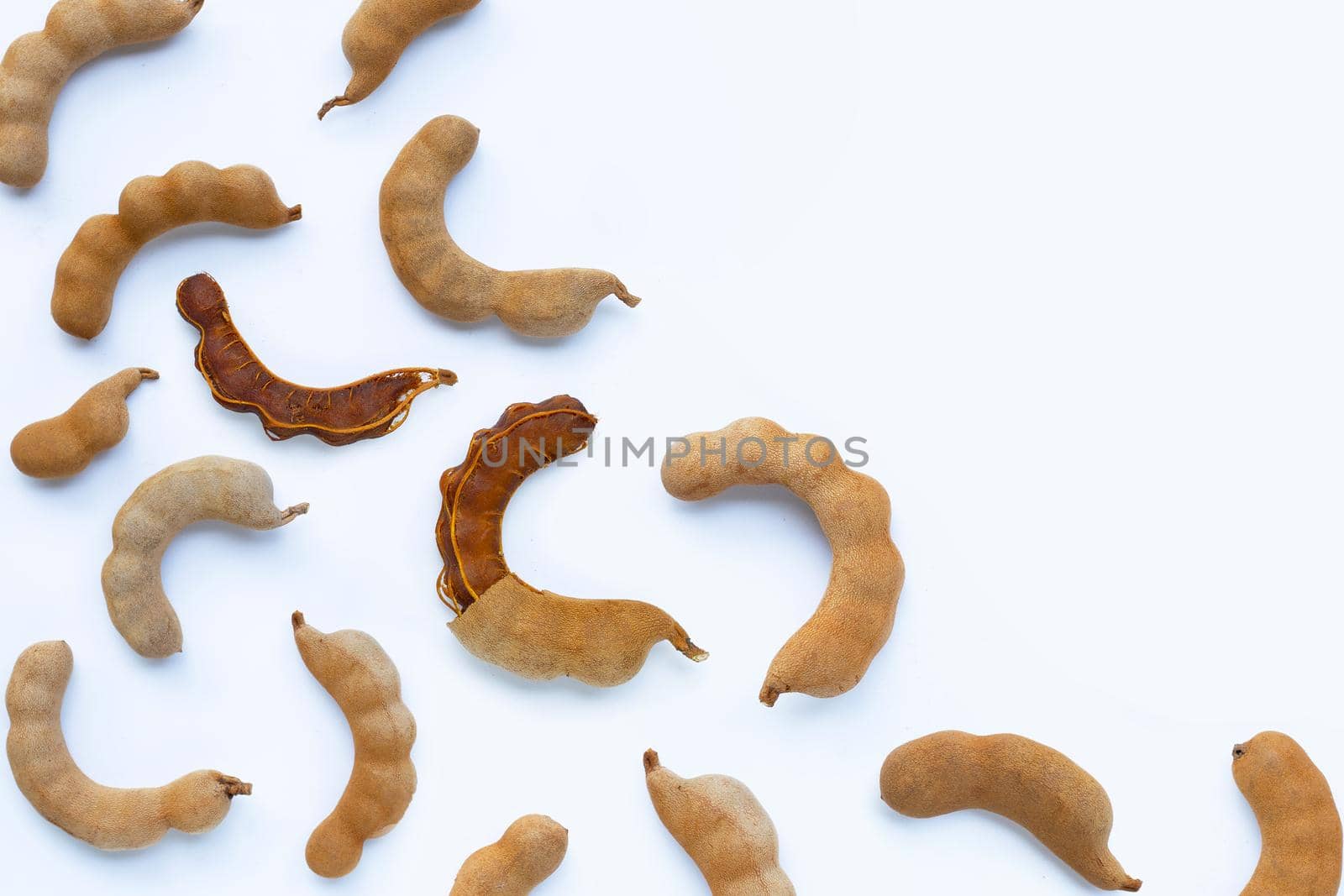 Tamarind tropical fruit on white background. Top view