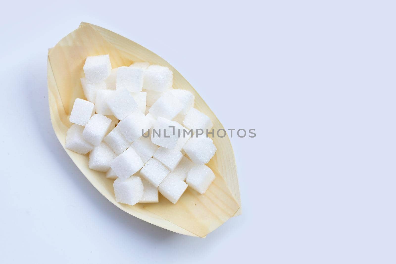 Cubes of sugar on white background. Copy space